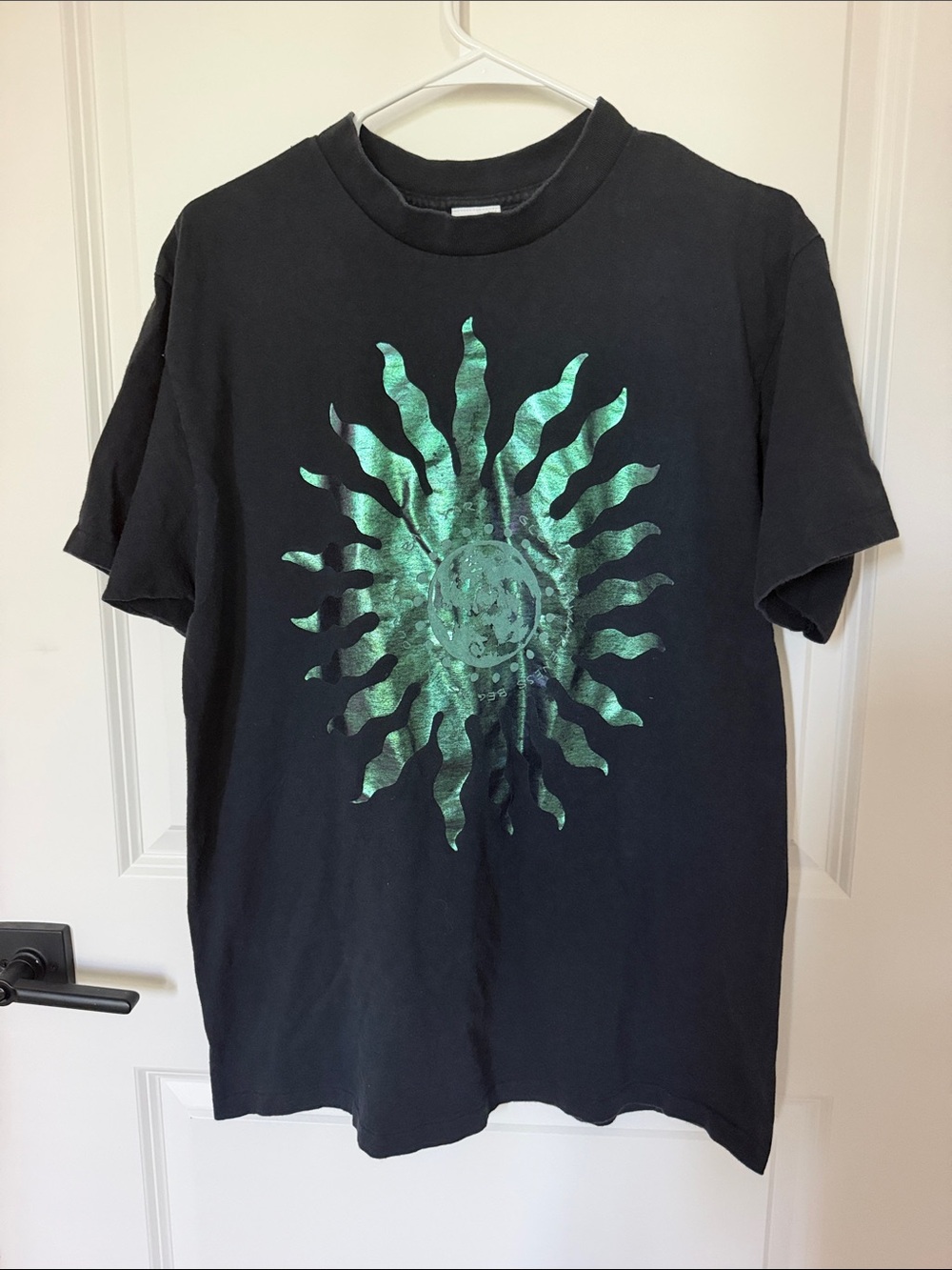 Black Graphic Tee with Green Metallic Sun Design